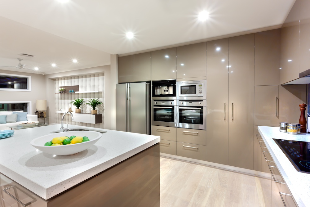 Floor to ceiling Wall cabinets with the ovens and the refrigerator