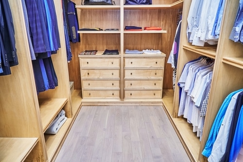 Closet with crown molding in it